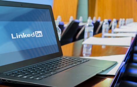 Laptop Displaying LinkedIn In Corporate Boardroom