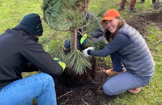 Liesl Forve planting a tree in Portland, Oregon