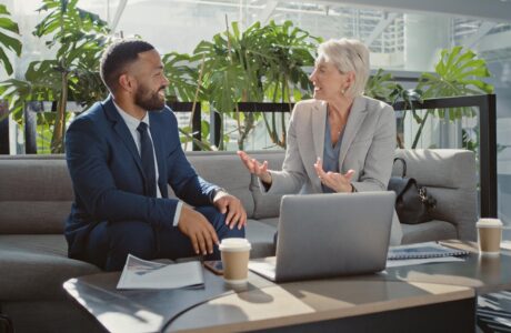 Business Man And Woman Drinking Coffee And Networking