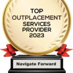 Image of a trophy, gold circle on black base with red ribbon, recognizing Navigate Forward as a Top Outplacement Services Provider of 2023
